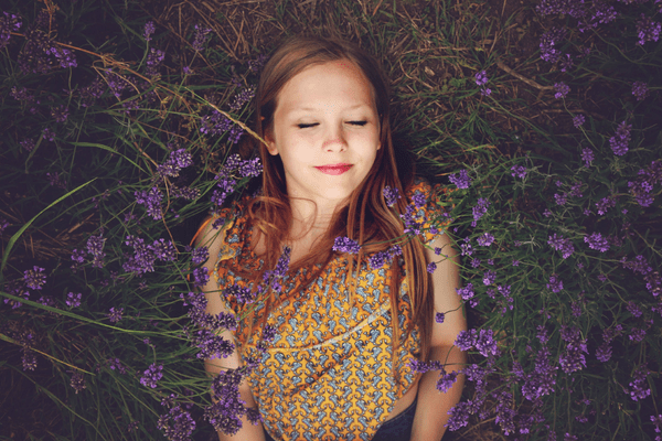 Sleeping girl in field of lavender